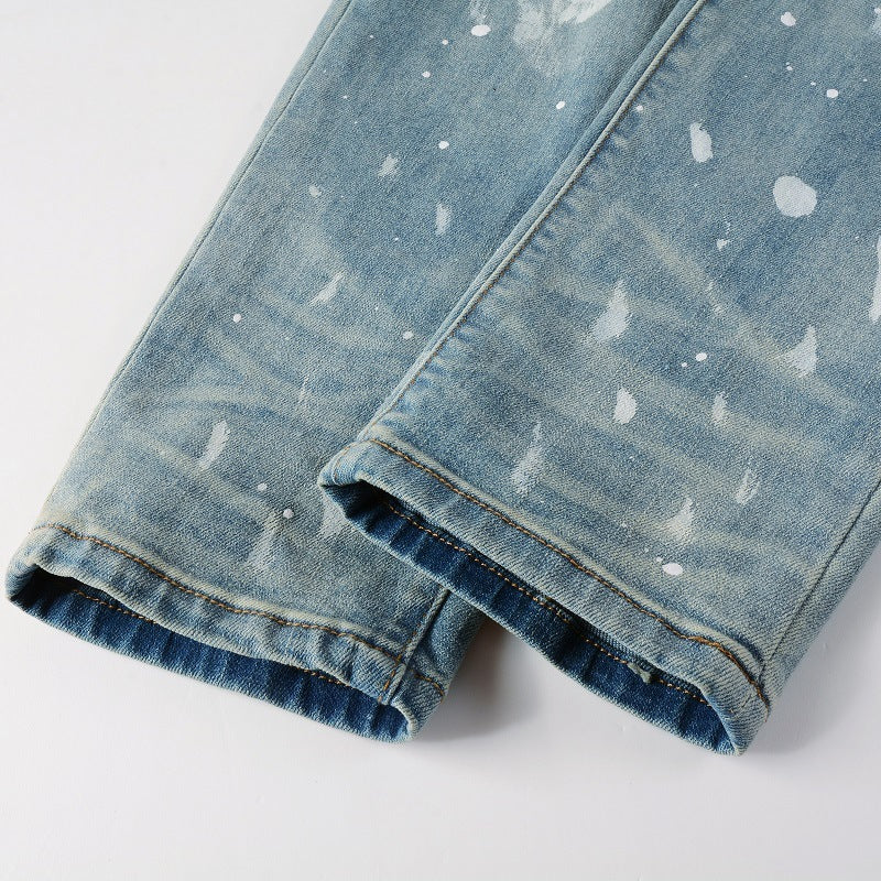 Jeans vintage con agujeros y pintura para hombre