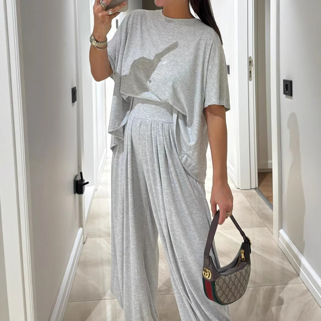 Conjunto de ropa femenina de dos piezas: pantalones holgados de pierna ancha y blusa, estilo casual y color sólido, cómodo y relajado.