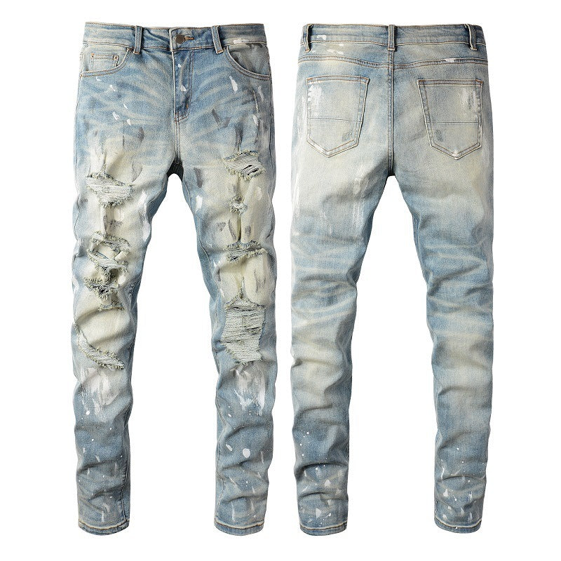 Jeans vintage con agujeros y pintura para hombre