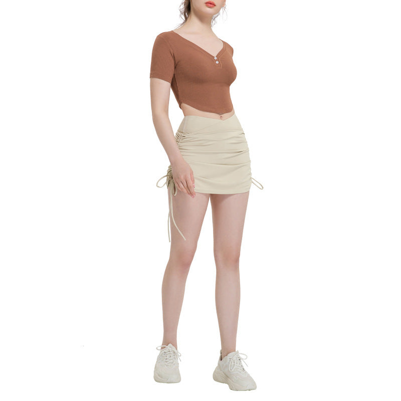 Falda deportiva corta con cordón y shorts integrados para mujer
