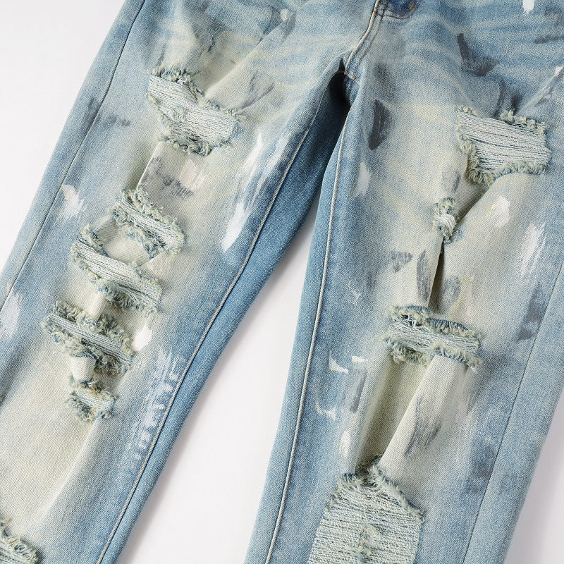 Jeans vintage con agujeros y pintura para hombre