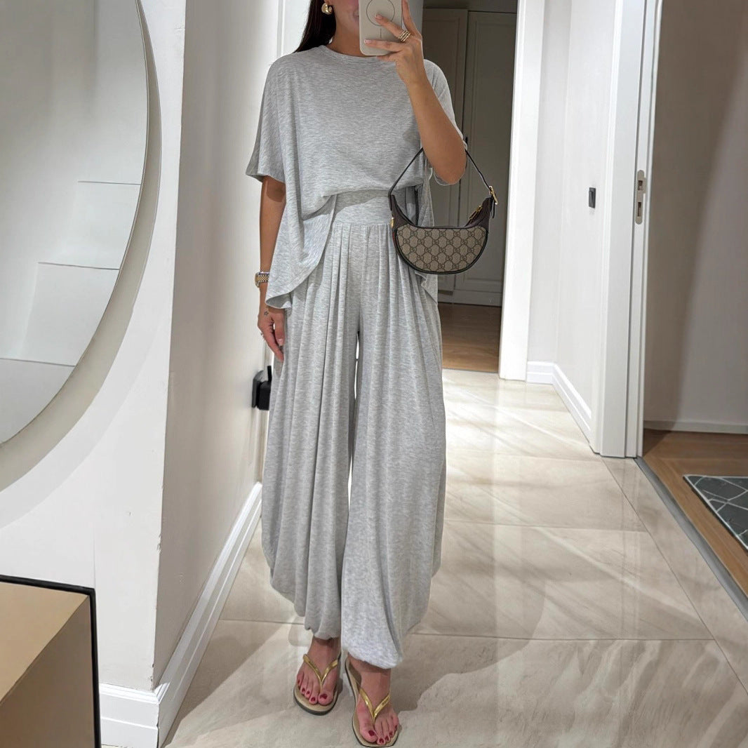 Conjunto de ropa femenina de dos piezas: pantalones holgados de pierna ancha y blusa, estilo casual y color sólido, cómodo y relajado.