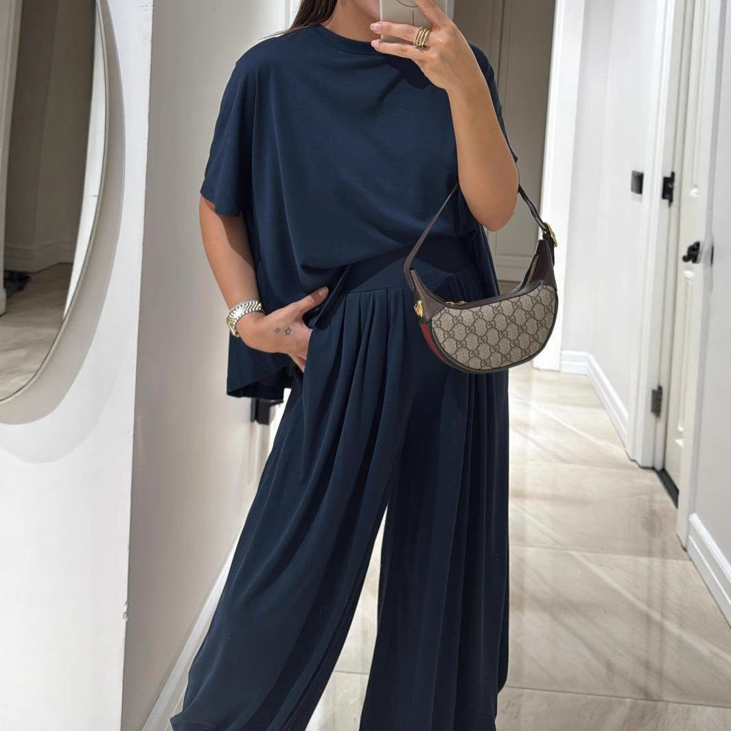 Conjunto de ropa femenina de dos piezas: pantalones holgados de pierna ancha y blusa, estilo casual y color sólido, cómodo y relajado.