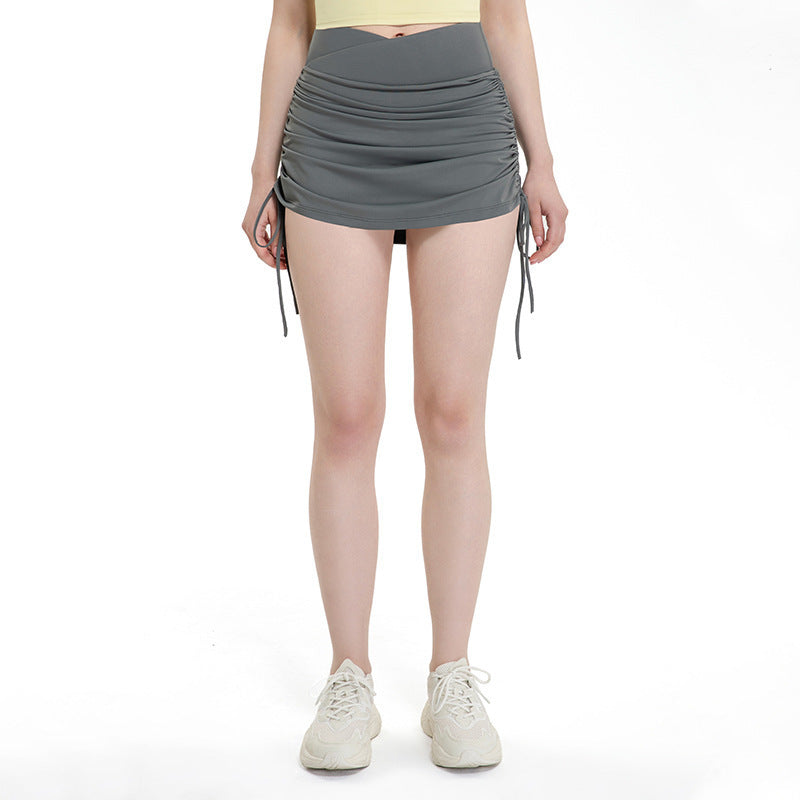 Falda deportiva corta con cordón y shorts integrados para mujer