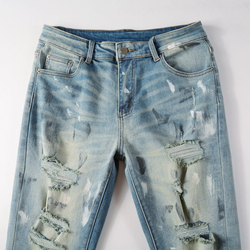 Jeans vintage con agujeros y pintura para hombre