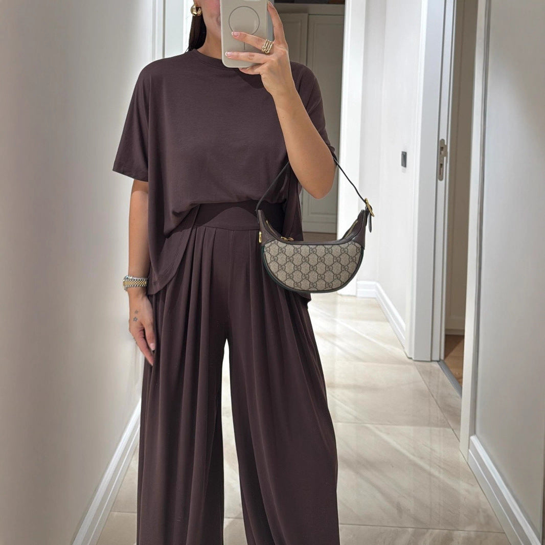 Conjunto de ropa femenina de dos piezas: pantalones holgados de pierna ancha y blusa, estilo casual y color sólido, cómodo y relajado.