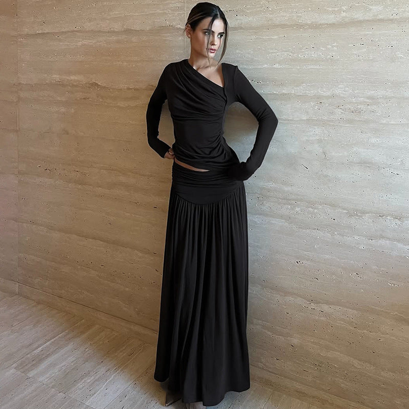 Nuevo conjunto elegante de top de manga larga con falda plisada de corte ajustado.